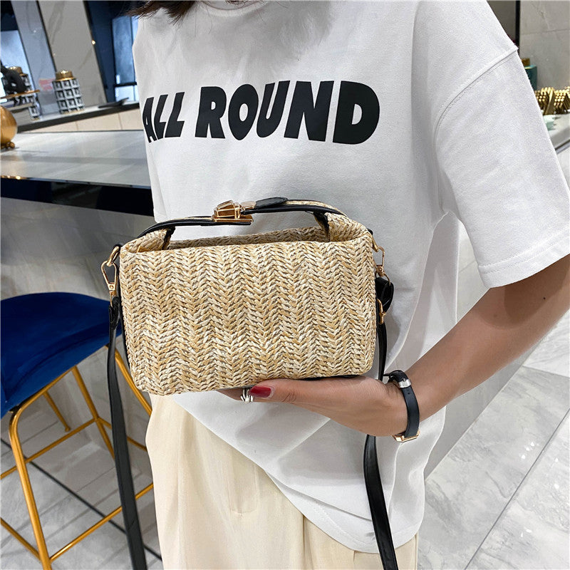 Chic Straw Crossbody Bag with Black Trim and Gold Hardware
