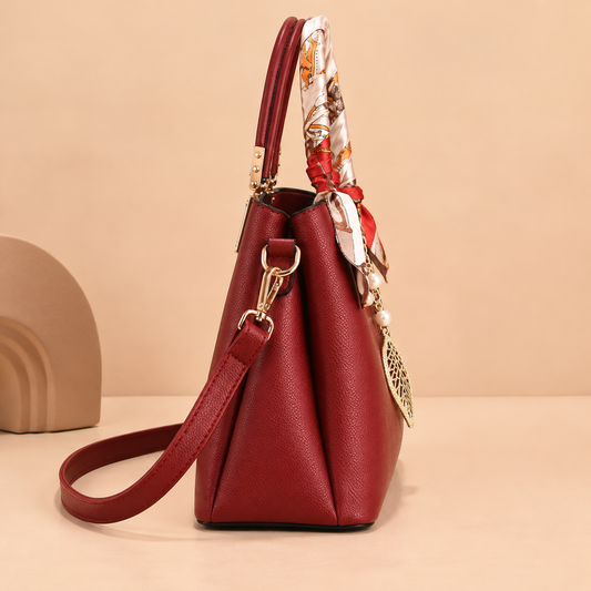 Leather Shoulder Bag with Scarf-Wrapped Handles and Gold Leaf Charm