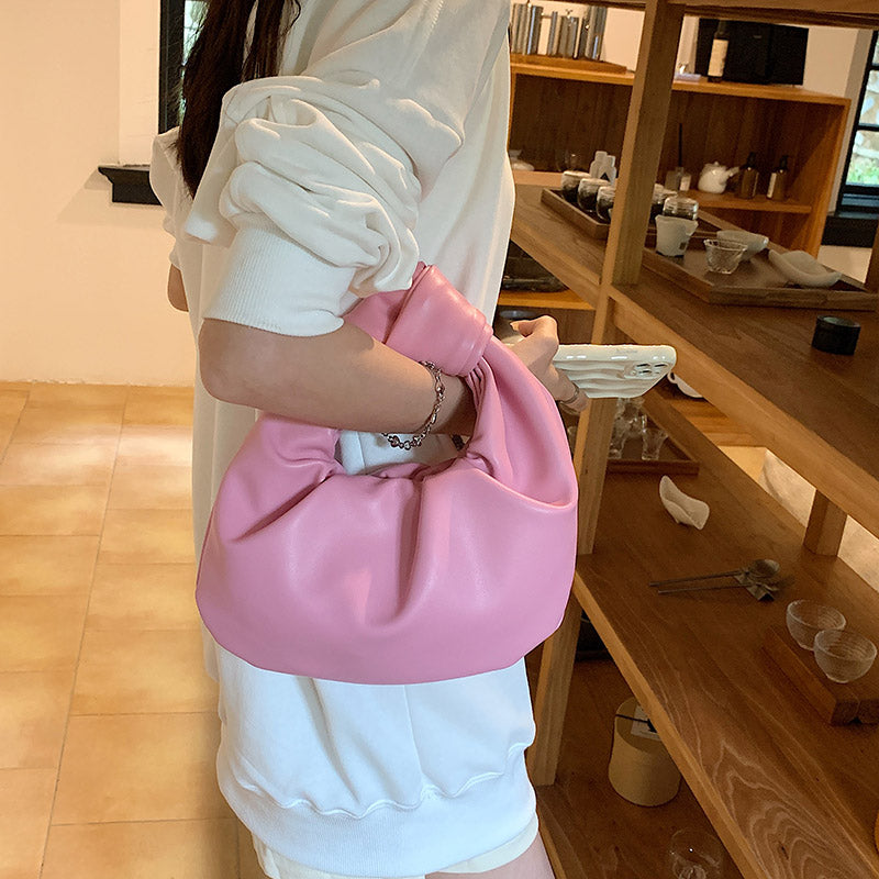 Sleek Leather Shoulder Bag with Knotted Handle and Gathered Body