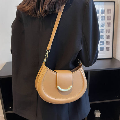 Black Leather Shoulder Bag with Gold Hardware and Flap Closure