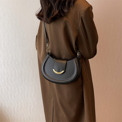 Black Leather Shoulder Bag with Gold Hardware and Flap Closure