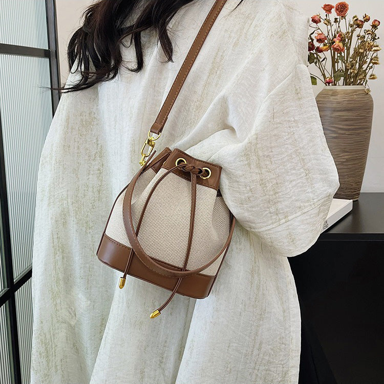 Canvas and Leather Bucket Bag with Drawstring and Gold Hardware