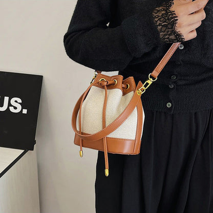Canvas and Leather Bucket Bag with Drawstring and Gold Hardware