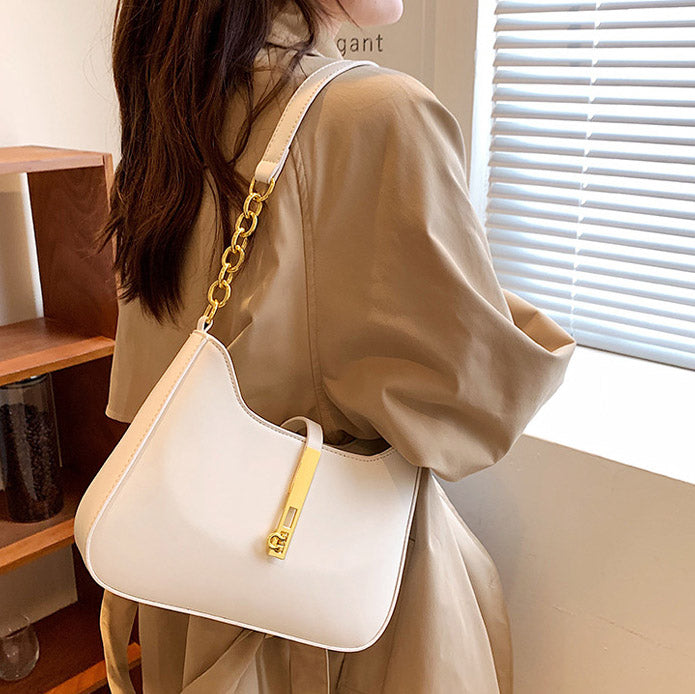 Chic Leather Shoulder Bag with Gold Chain and Bar Closure