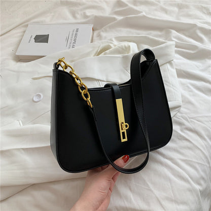 Chic Leather Shoulder Bag with Gold Chain and Bar Closure