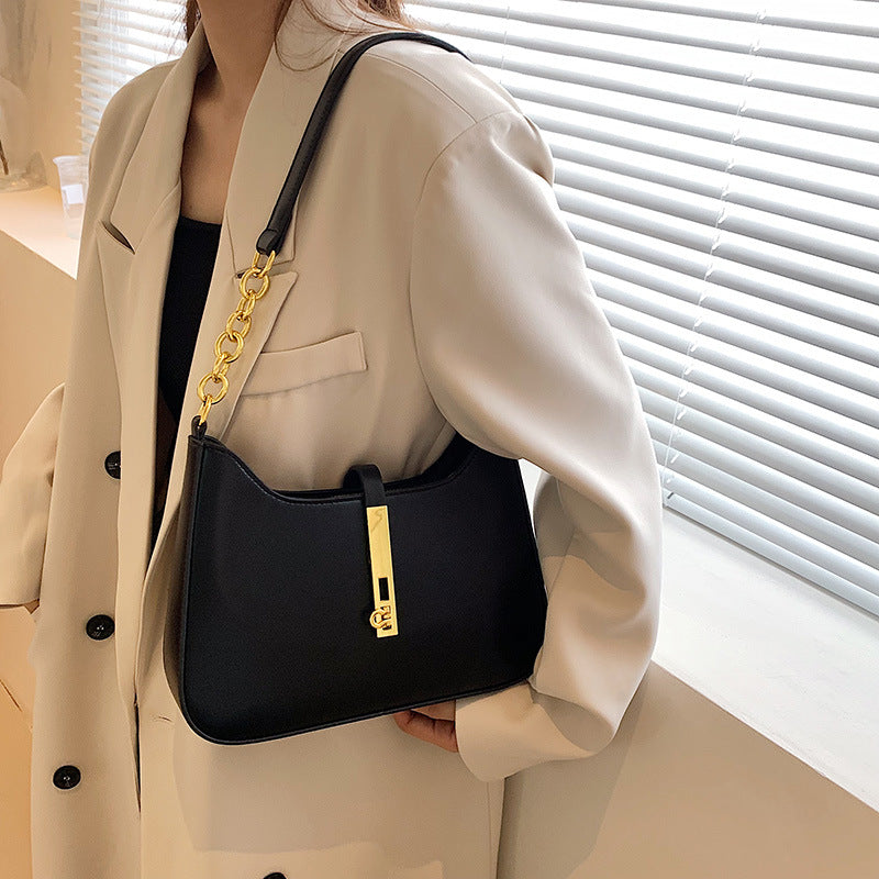 Chic Leather Shoulder Bag with Gold Chain and Bar Closure