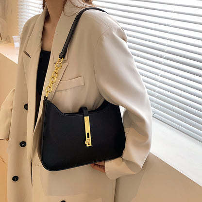 Chic Leather Shoulder Bag with Gold Chain and Bar Closure