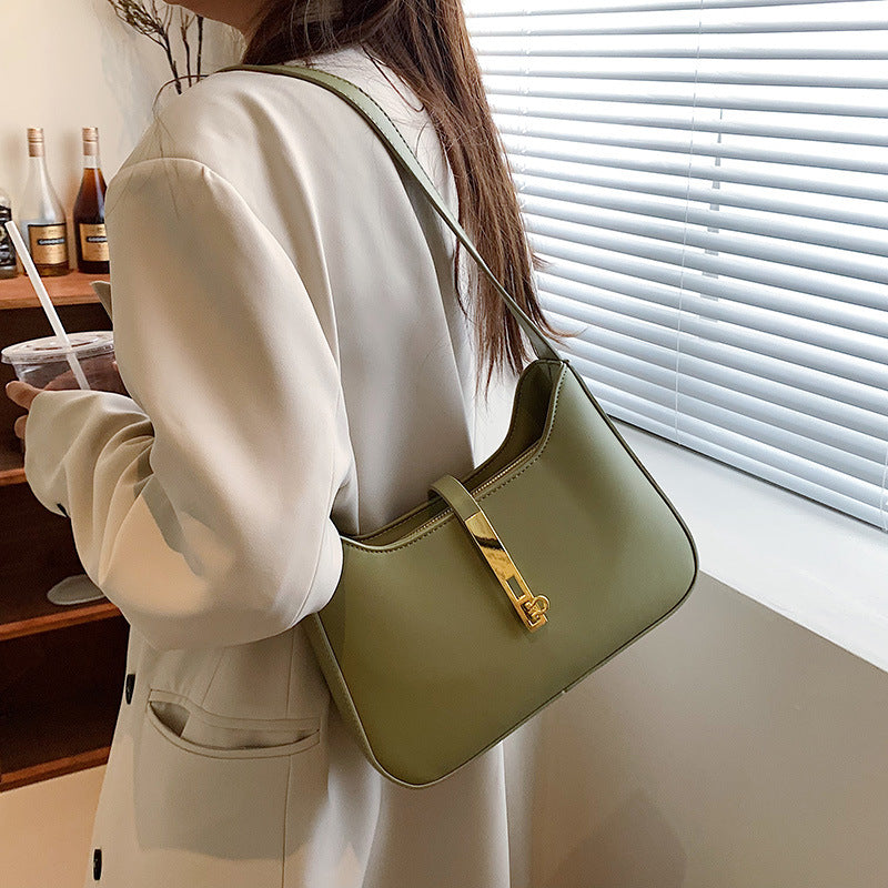 Chic Leather Shoulder Bag with Gold Chain and Bar Closure