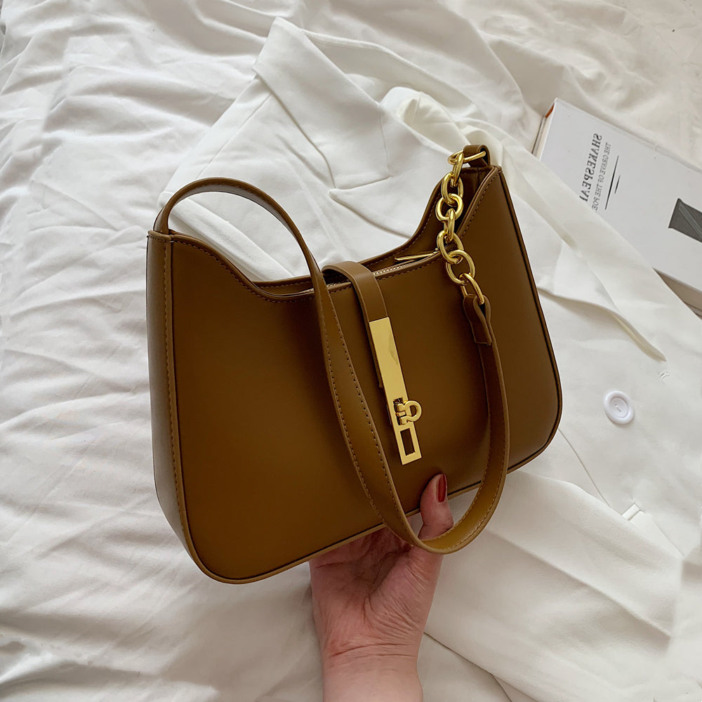 Chic Leather Shoulder Bag with Gold Chain and Bar Closure