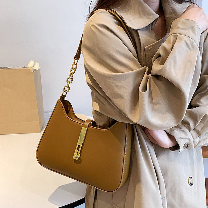 Chic Leather Shoulder Bag with Gold Chain and Bar Closure