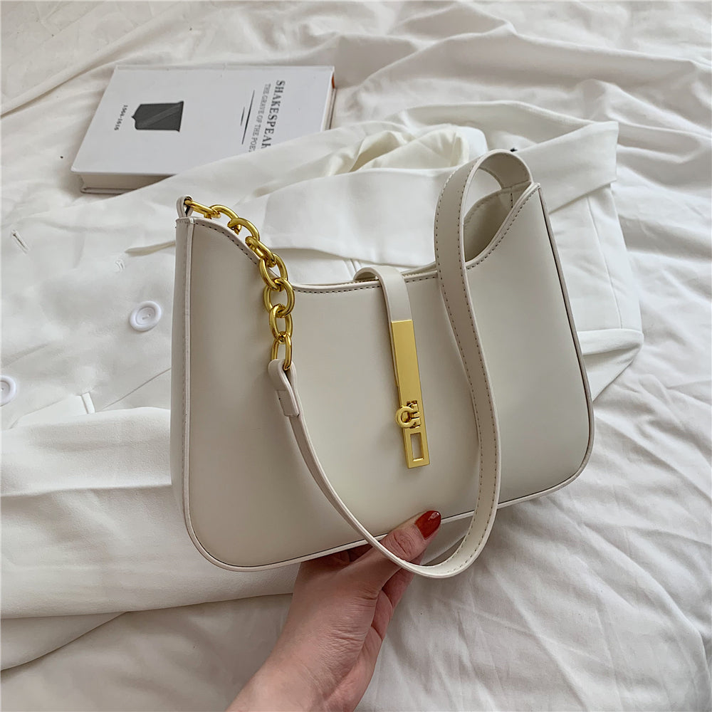 Chic Leather Shoulder Bag with Gold Chain and Bar Closure