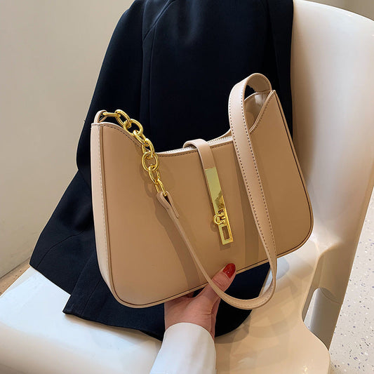 Chic Leather Shoulder Bag with Gold Chain and Bar Closure
