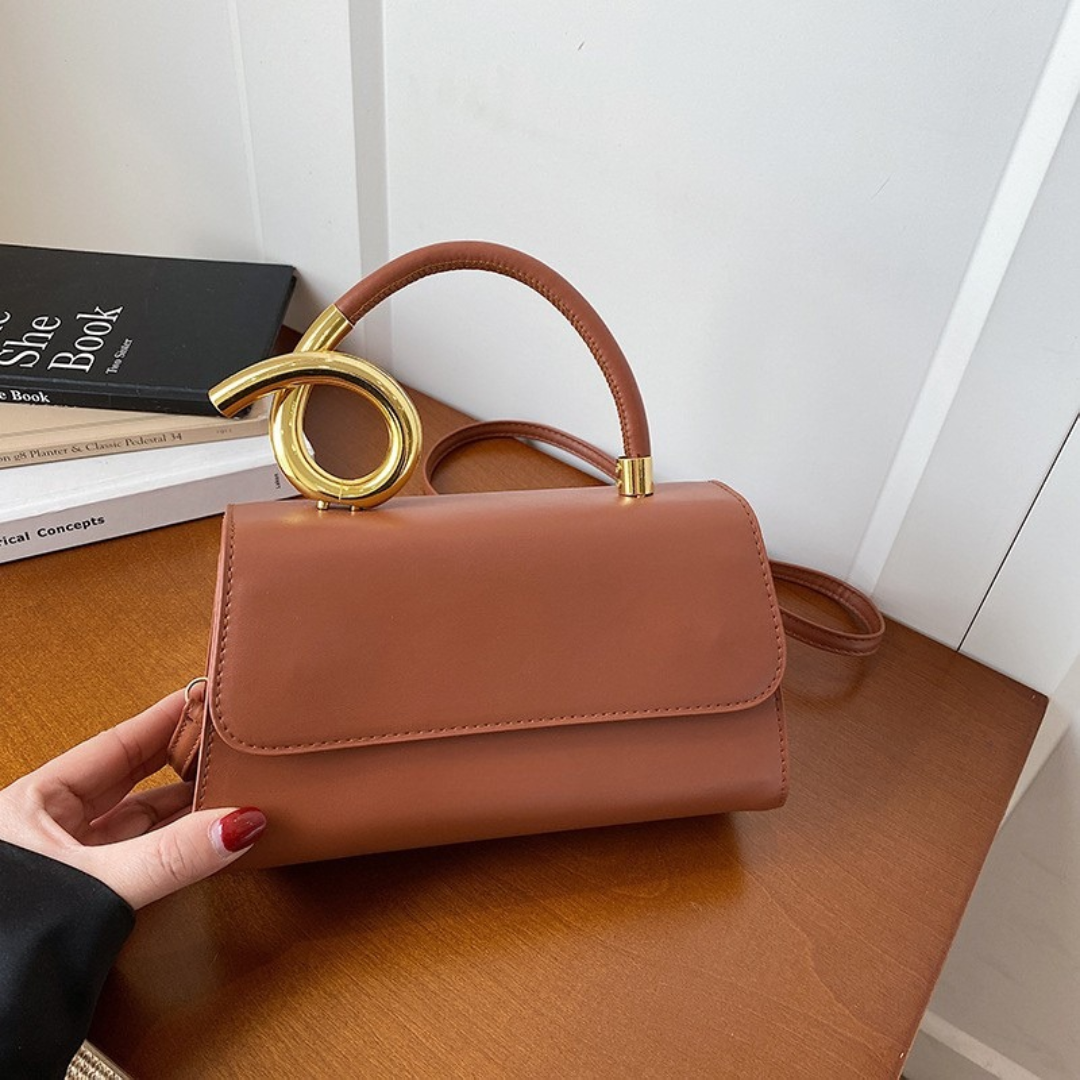Chic Leather Shoulder Bag with Sculptural Gold Handle