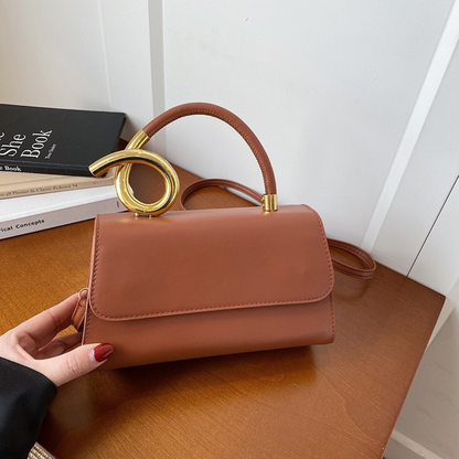 Chic Leather Shoulder Bag with Sculptural Gold Handle