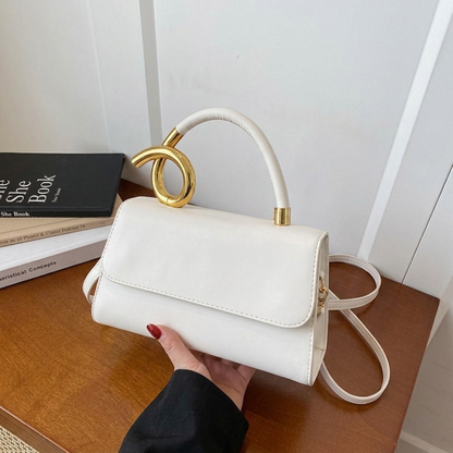 Chic Leather Shoulder Bag with Sculptural Gold Handle