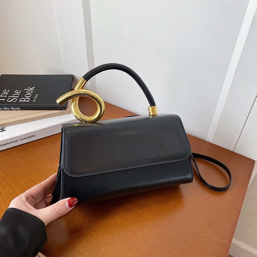 Chic Leather Shoulder Bag with Sculptural Gold Handle
