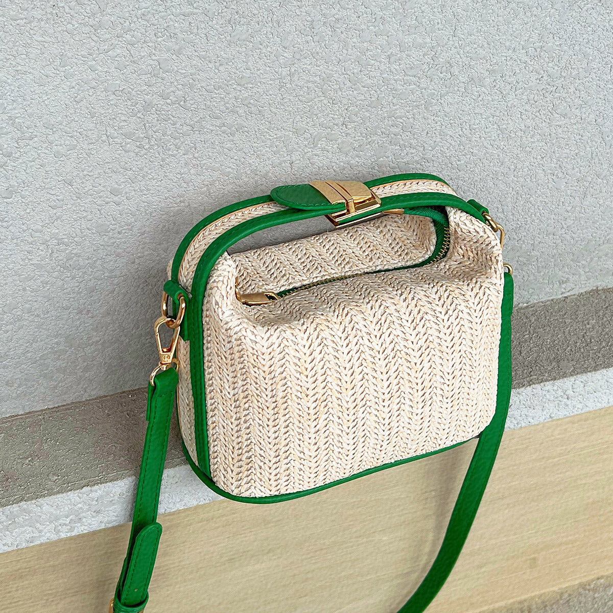Chic Straw Crossbody Bag with Black Trim and Gold Hardware