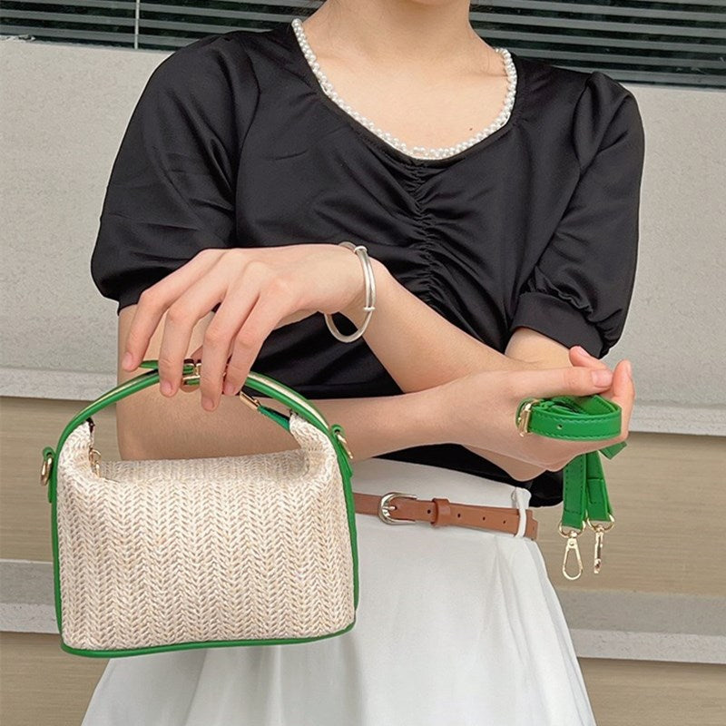 Chic Straw Crossbody Bag with Black Trim and Gold Hardware
