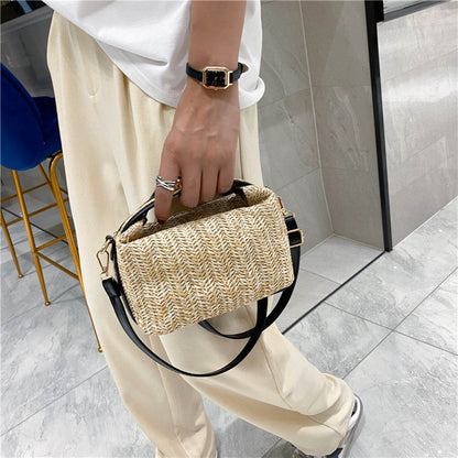 Chic Straw Crossbody Bag with Black Trim and Gold Hardware