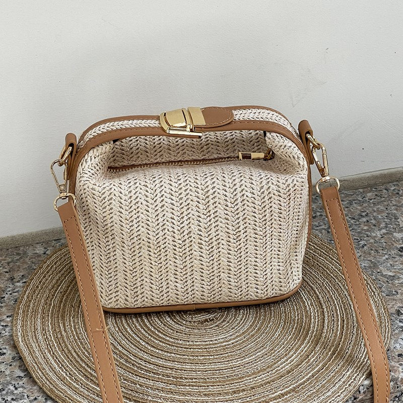 Chic Straw Crossbody Bag with Black Trim and Gold Hardware