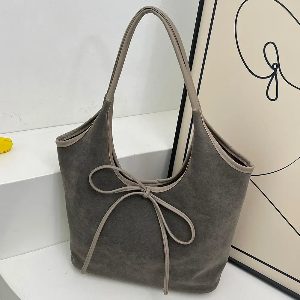 Chic Suede Shoulder Bag with Bow Detail
