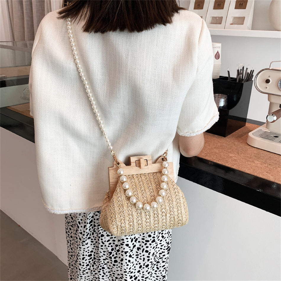 Chic Woven Straw Bag with Pearl Handle and Wood Clasp