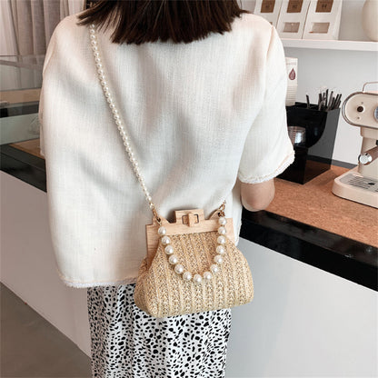 Chic Woven Straw Bag with Pearl Handle and Wood Clasp