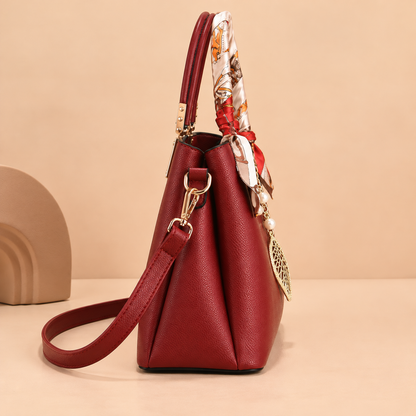 Leather Shoulder Bag with Scarf-Wrapped Handles and Gold Leaf Charm