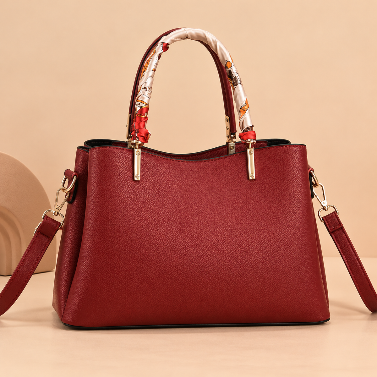 Leather Shoulder Bag with Scarf-Wrapped Handles and Gold Leaf Charm