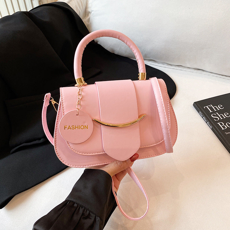 Polished Leather Top Handle Bag with Gold Hardware and Crossbody Strap
