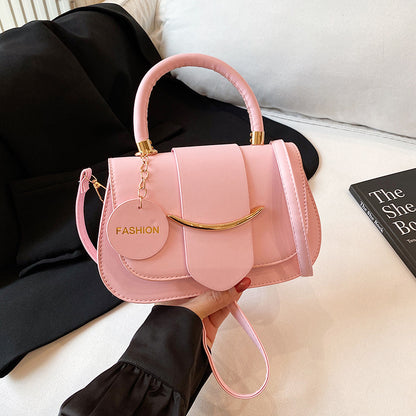 Polished Leather Top Handle Bag with Gold Hardware and Crossbody Strap