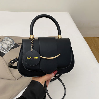 Polished Leather Top Handle Bag with Gold Hardware and Crossbody Strap