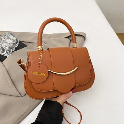 Polished Leather Top Handle Bag with Gold Hardware and Crossbody Strap