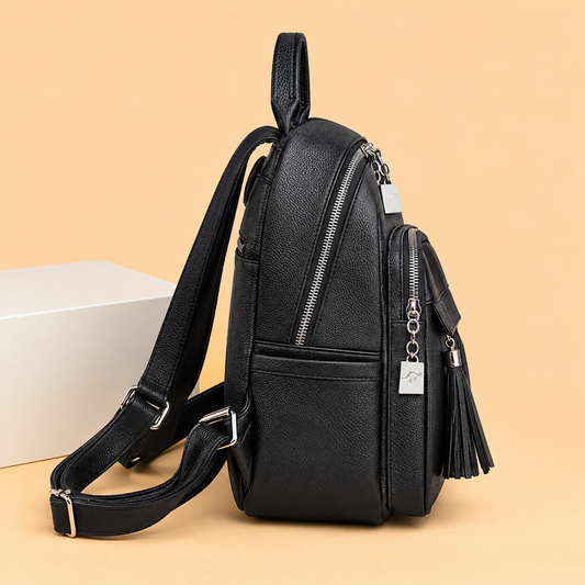 Sleek Leather Backpack with Tassel Detail and Silver Hardware