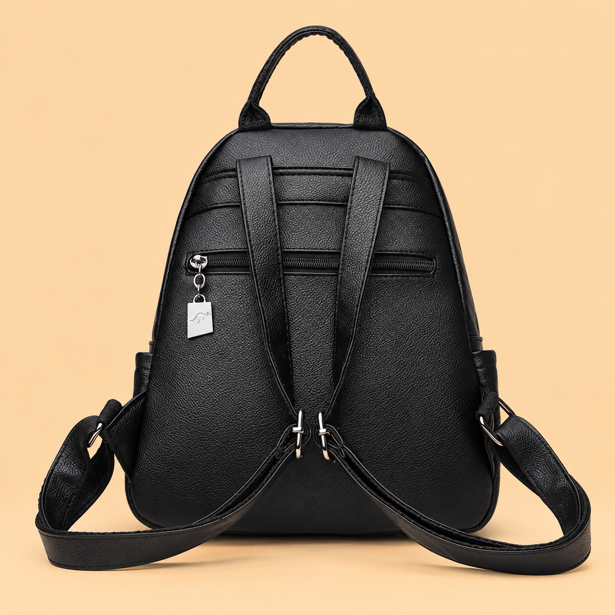 Sleek Leather Backpack with Tassel Detail and Silver Hardware