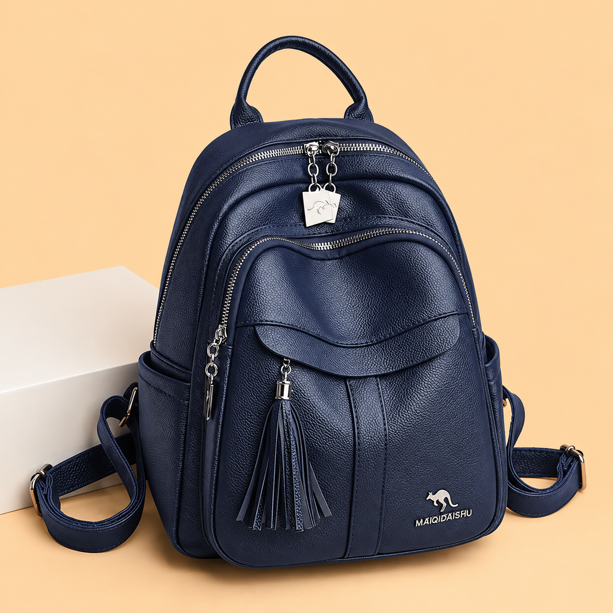 Sleek Leather Backpack with Tassel Detail and Silver Hardware