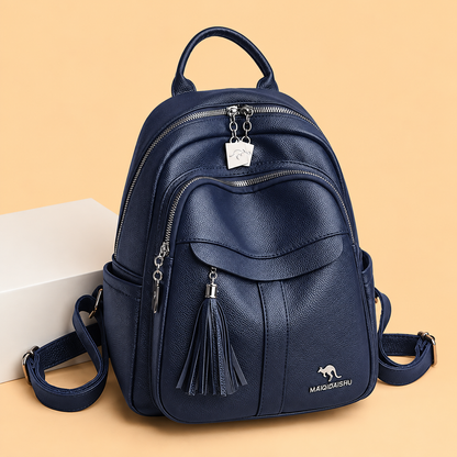 Sleek Leather Backpack with Tassel Detail and Silver Hardware