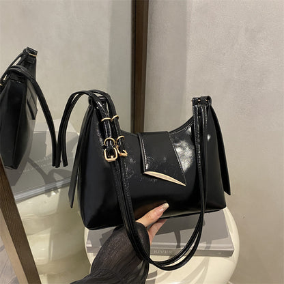 Sleek Leather Shoulder Bag with Gold Hardware and Front Pocket