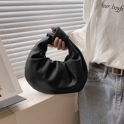 Sleek Leather Shoulder Bag with Knotted Handle and Gathered Body