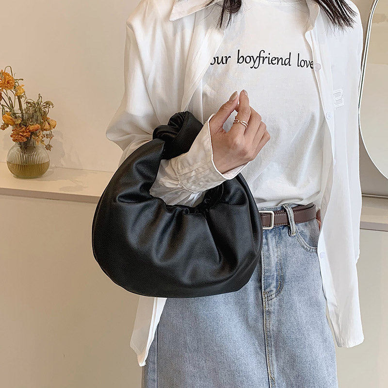 Sleek Leather Shoulder Bag with Knotted Handle and Gathered Body