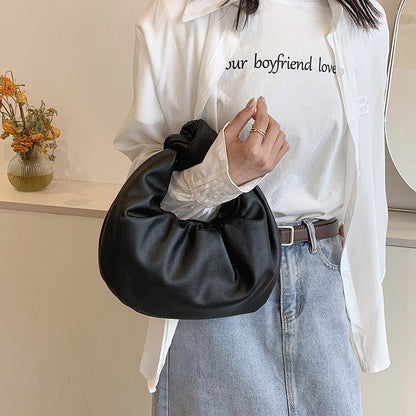 Sleek Leather Shoulder Bag with Knotted Handle and Gathered Body