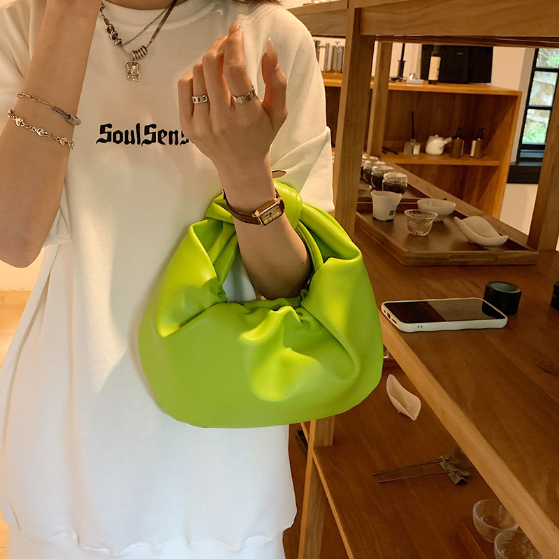 Sleek Leather Shoulder Bag with Knotted Handle and Gathered Body