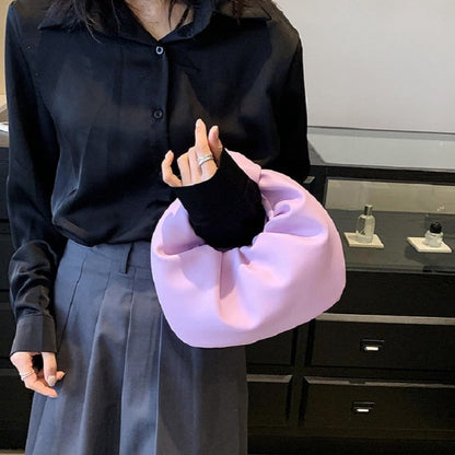 Sleek Leather Shoulder Bag with Knotted Handle and Gathered Body