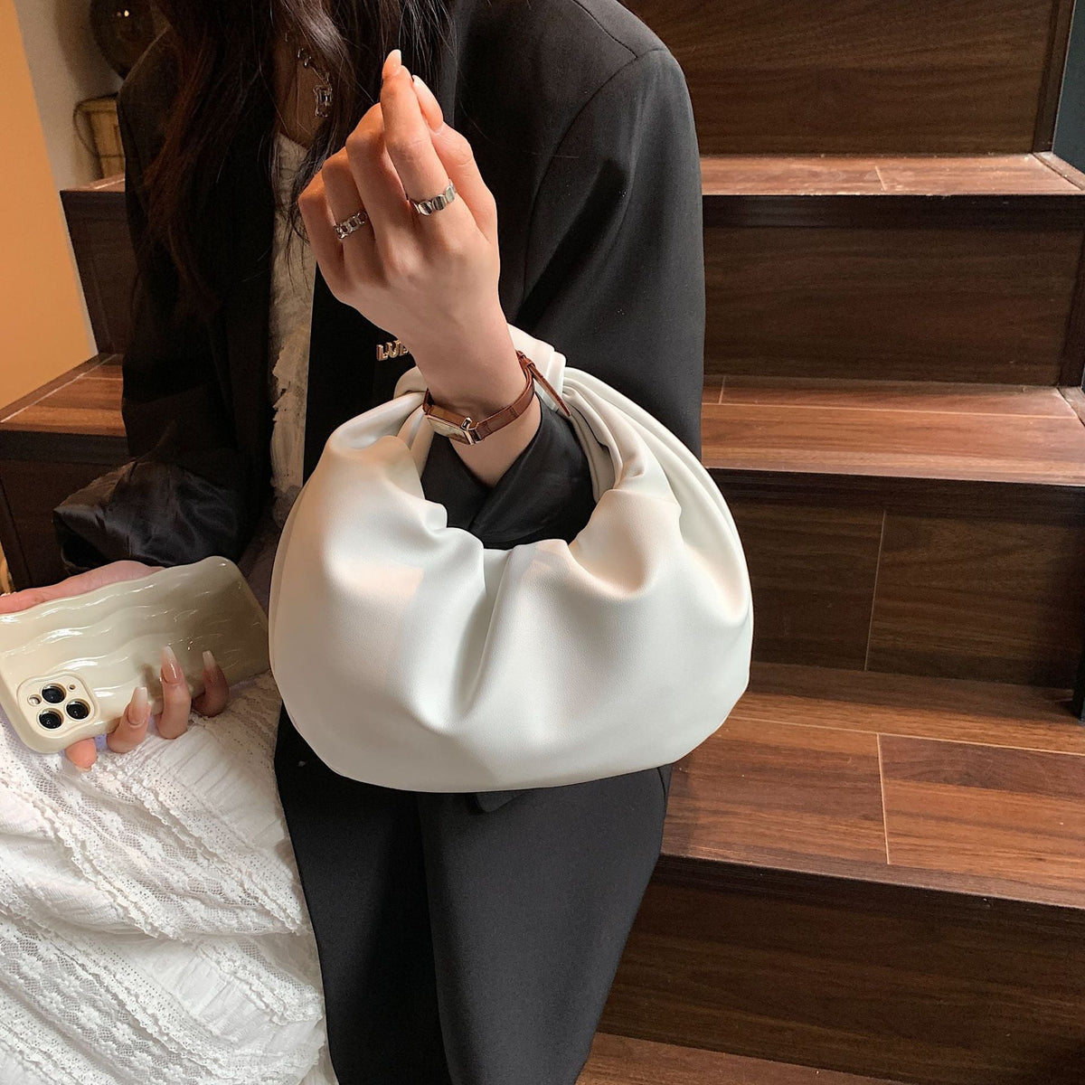Sleek Leather Shoulder Bag with Knotted Handle and Gathered Body