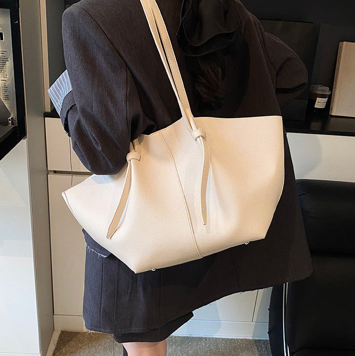 Sleek Leather Tote Bag with Knot Strap Detail