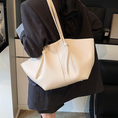 Sleek Leather Tote Bag with Knot Strap Detail