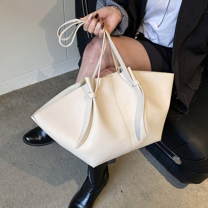 Sleek Leather Tote Bag with Knot Strap Detail