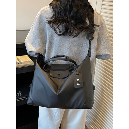 Sleek Leather Weekend and Travel Bag with Detachable Shoulder Strap