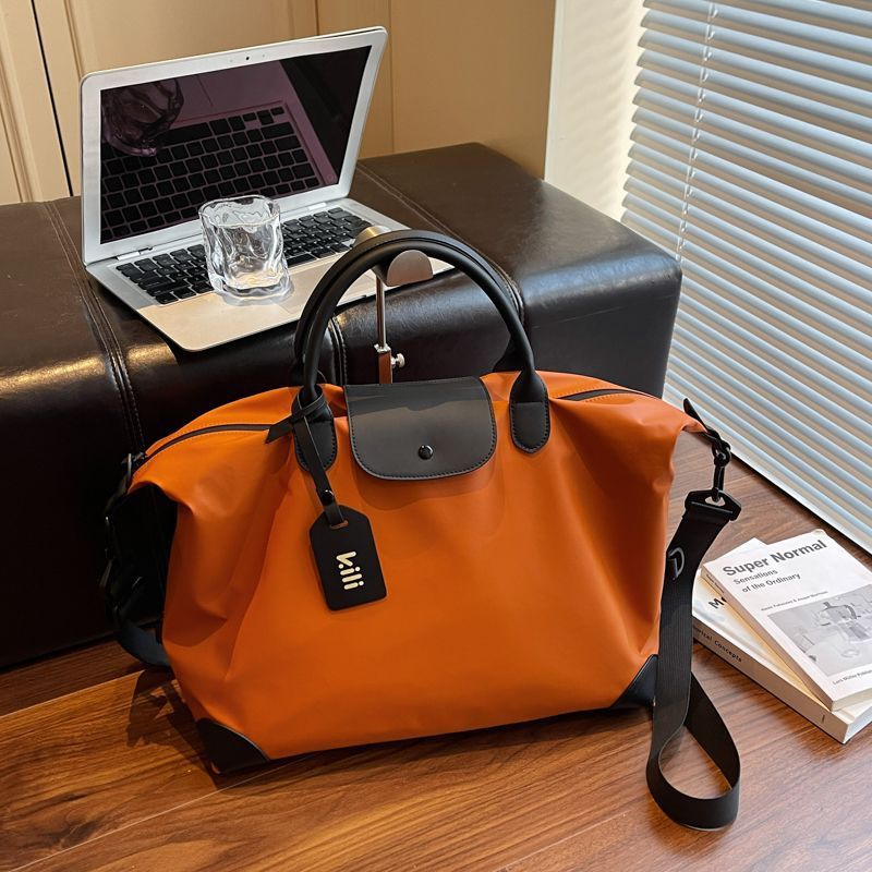Sleek Leather Weekend and Travel Bag with Detachable Shoulder Strap