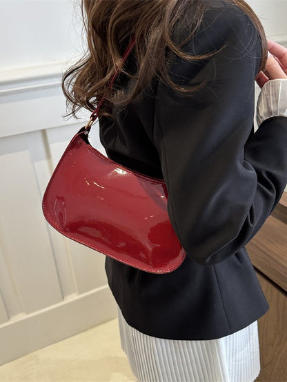 Sleek Patent Leather Shoulder Bag with Gold Hardware